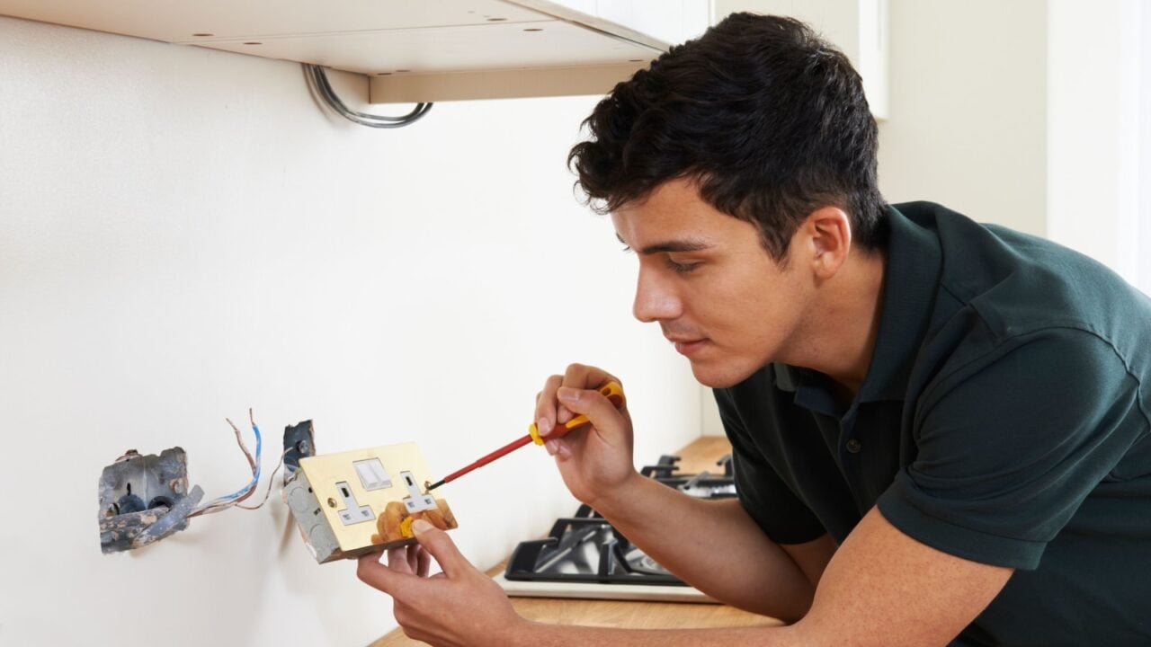 Electrician Installing Socket In New House