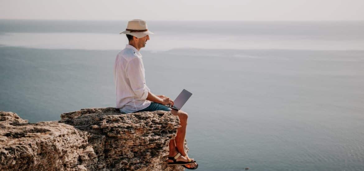 man working on the edge of cliff