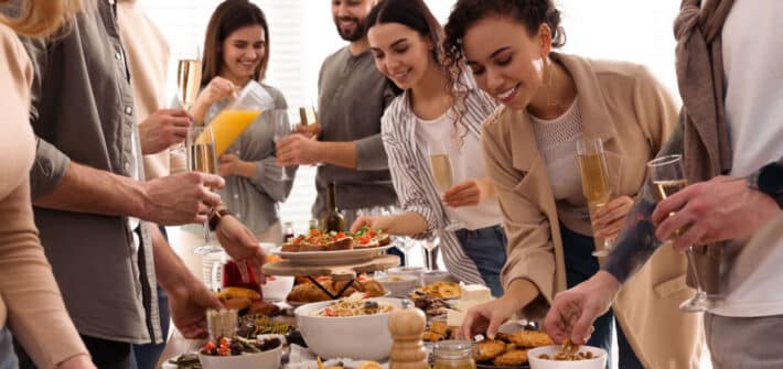 People eating food at a party.