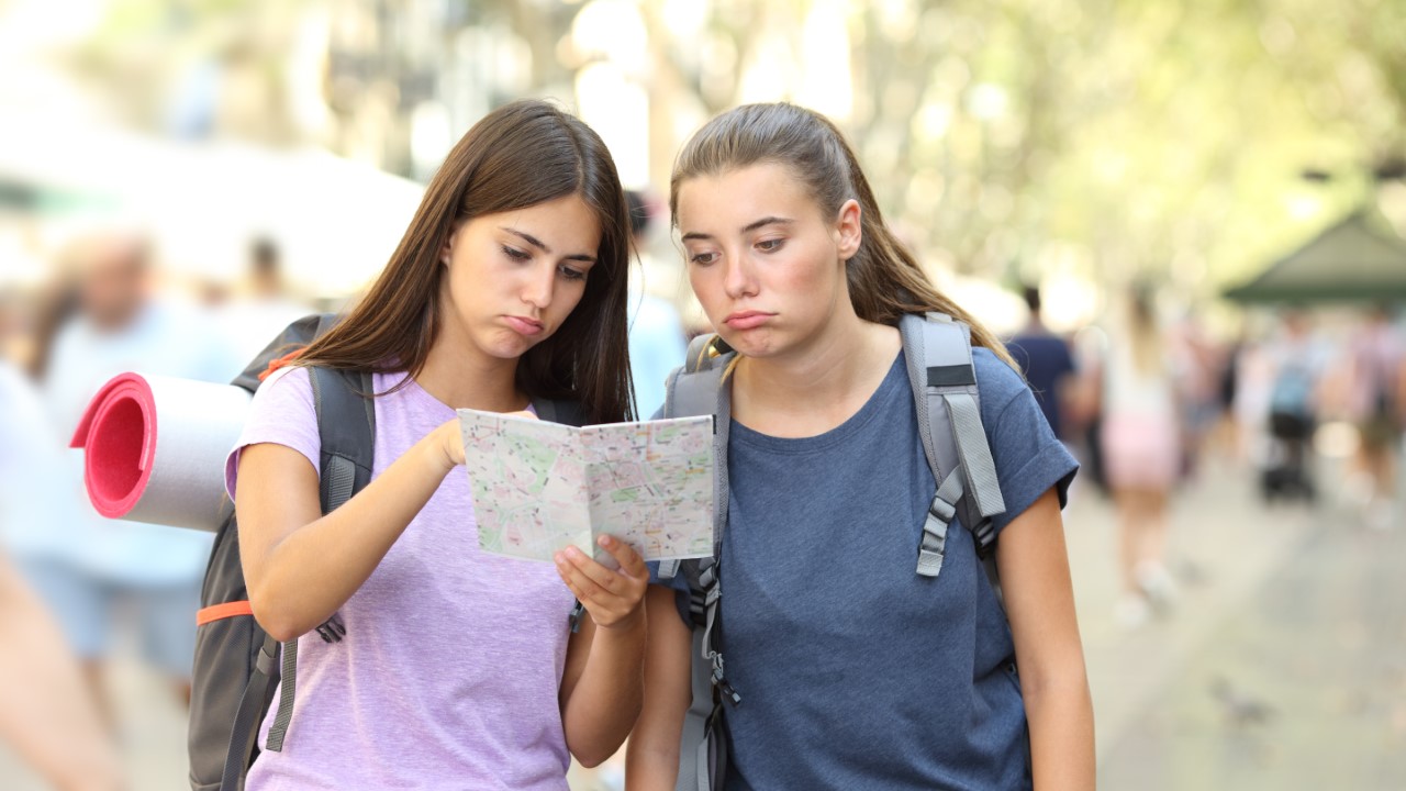 Tired Tourist Women looking at map