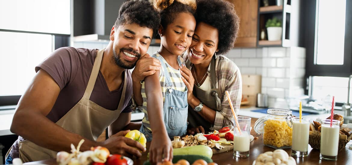 Happy family having fun together at home in the kitchen