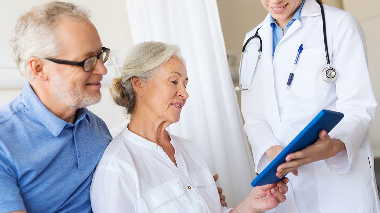 medicine, age, health care and people concept - senior woman, man and doctor with tablet pc computer at hospital ward