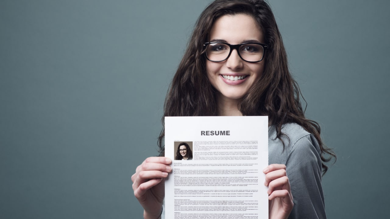 Young woman advertising her resume writing and career coaching skills